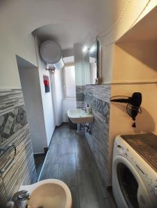 a small bathroom with a sink and a toilet at Two Rooms Bellini in Catania +30 photos