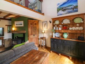 a living room with a couch and a table at Pen Glorian in Conwy +43 photos