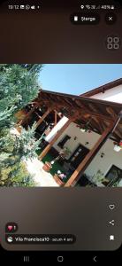 a television screen with a picture of a building at Vila Francisca10 in Alba Iulia