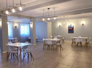 a large room with tables and chairs in it at Vila Francisca10 in Alba Iulia