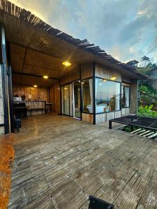 a house with a deck with a view of the ocean at Mon Ngo misty haven B2 in Ban Mae Ta Man