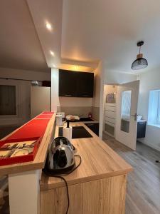 a kitchen with a counter top and a kitchen island at L'Essentiel de Paray in Paray-le-Monial