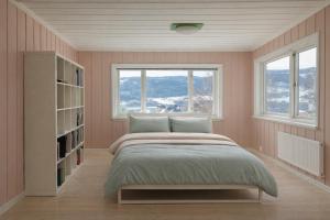a bedroom with a bed and two windows at Spacious Villa in Lillehammer in Lillehammer