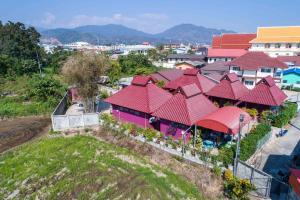 an aerial view of a house with red roofs at Baan Buapatumma in Mae Sai
