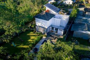 an overhead view of a large white building at The Lavana Signature Villa Herrera Puncak in Puncak