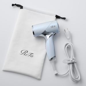 a hair dryer and a pair of scissors at Richmond Hotel Sapporo Ekimae in Sapporo