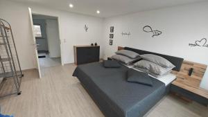 a bedroom with a bed with two pillows on it at Residenz Agnes in Beckingen