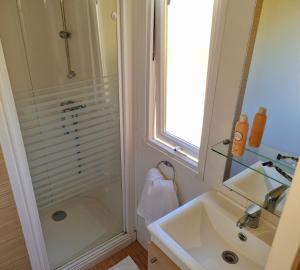 a bathroom with a shower and a sink at Parc- Camping de Coullons in Coullons +42 photos
