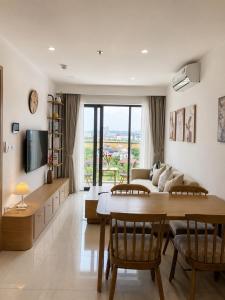 a living room with a couch and a table at Nera Stay Huế - Luxury Apartment in Hue
