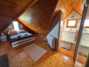 a bedroom with a bed in a attic at Paloznak Panoráma in Paloznak