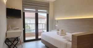 Postel nebo postele na pokoji v ubytování Hotel Las Dunas