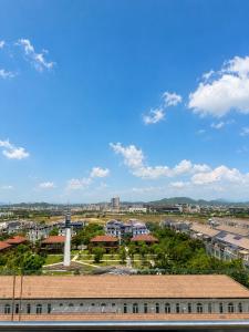 a view of a city from the roof of a building at Nera Stay Huế - Luxury Apartment in Hue