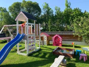a playground with a slide and a play structure at Malinovy Sen II in Habovka +59 photos