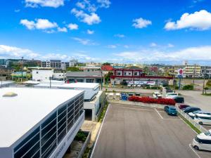 arial view of a parking lot in a city at MrKINJO in Air Resort in Hirara +10 photos