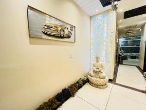 a picture of a car hanging on a wall at Southern Stays in New Delhi