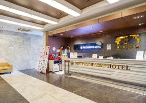 a lobby of a hotel with a reception counter at Wolmido Premiers Hotel in Incheon