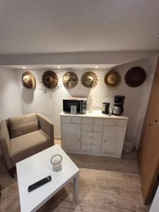 a living room with a couch and a coffee table at Reinecke Fuchs in Bad Münder am Deister