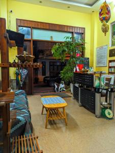 a living room with a couch and a table at Sunny C Hotel in Hue