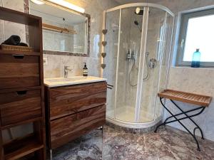 a bathroom with a shower and a sink at Ferienhaus Chalet Kitzalp in Sankt Johann in Tirol +42 photos
