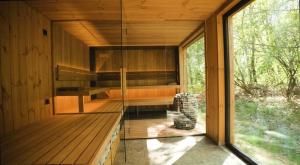 a glass room in a wooden house with a window at reBORONA in Őriszentpéter +61 photos