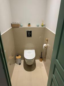 a bathroom with a white toilet in a room at Maison en campagne in Salon-de-Provence +18 photos