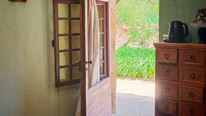 an open door to a room with a dresser at Bonfarto Locations in Urval