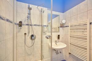 a bathroom with a shower and a sink at Ferienanlage Kirchzarten in Kirchzarten