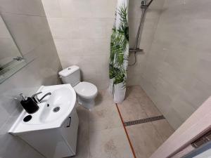 a bathroom with a sink and a toilet and a shower at Gospodarstwo Agroturystyczne E K Szabowscy in Jeżewo +22 photos