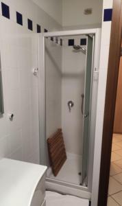 a shower with a glass door in a bathroom at casa raffa megaride's dépendance in Como +6 photos