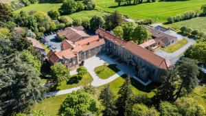 an aerial view of a large house with a roof at Villa de Meslay in Montaigu-Vendée