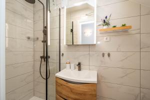 a bathroom with a sink and a shower at Angelina in Jakišnica +29 photos