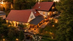 an aerial view of a large house with lights at Pension Nippgen in Radebeul