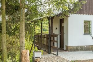 a front porch of a house with trees at Chata obklopena přírodou in Malé Žernoseky +8 photos