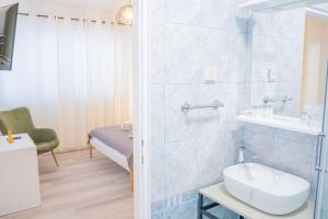 a bathroom with a toilet and a sink and a shower at Pansion Marinka-Bire Rooms in Lumbarda +35 photos
