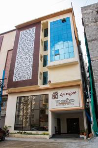 a building with a sign on the front of it at YC Grand Mystic Premier, Electronic City in Bangalore