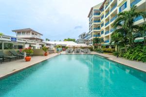 a large swimming pool in front of a building at Kantary Bay Hotel Phuket in Panwa Beach +80 photos