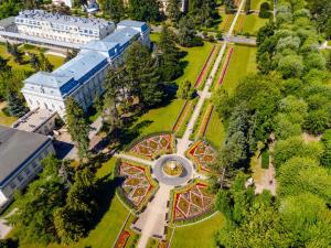 an aerial view of a park with a roller coaster at Łazienki Uzdrowiskowe Nr 1 in Ciechocinek