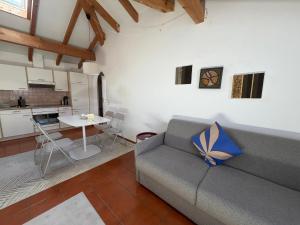 a living room with a couch and a table at Special apartment in Ascona in Ascona +15 photos