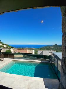 a swimming pool with a view of the ocean at Domaine La Chiusella in Monticello