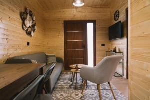 a living room with a couch and a table at Casa Arte 2 in Ulcinj
