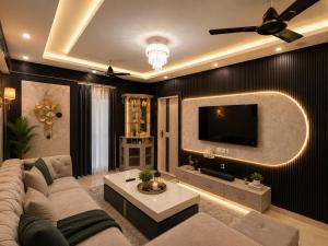 a living room with a couch and a tv at Dream Residency in Karnal