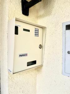 an electrical box on the side of a wall at Haus Bünten in Quinten