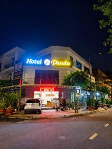 a hotel garage with a car parked in front of it at Panda Hotel in Long Thành