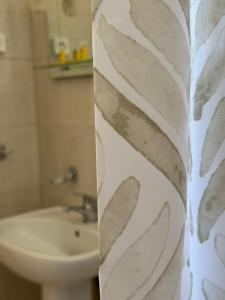 a bathroom with a toilet and a sink at Kofini Falassarna in Falasarna