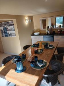 a wooden table with dishes on it in a kitchen at Domaine La Chiusella in Monticello