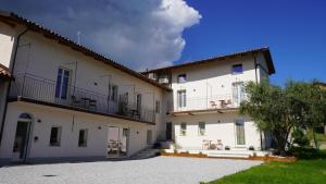an exterior view of a large white building at Casa Panerole in Novello