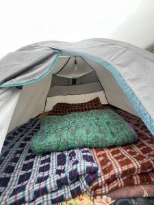 a bed in a tent in a room at The Kedar Stay in Kedārnāth