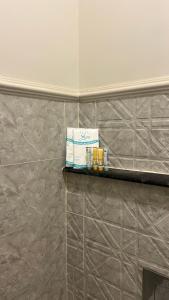 a shelf in a bathroom with a box on it at جناح ريفي in Al Yamāmah +11 photos