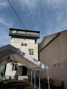aaaay hospital sign on the side of a building at Abay Hostel in Almaty