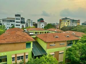 a group of houses with red roofs in a city at Bảo Anh Hotel in Hanoi